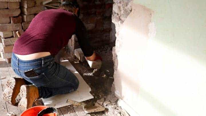 laying first course of bricks