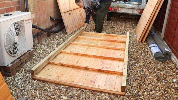 two lengths of pressure treated timber cut for shed base