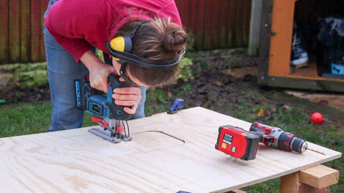 cutting out a hole for a treadmill control panel in desk using a jigsaw