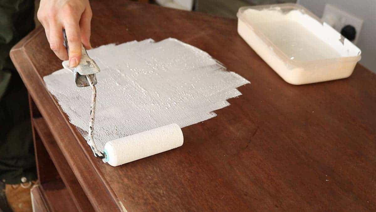 applying chalk paint with a mini foam roller