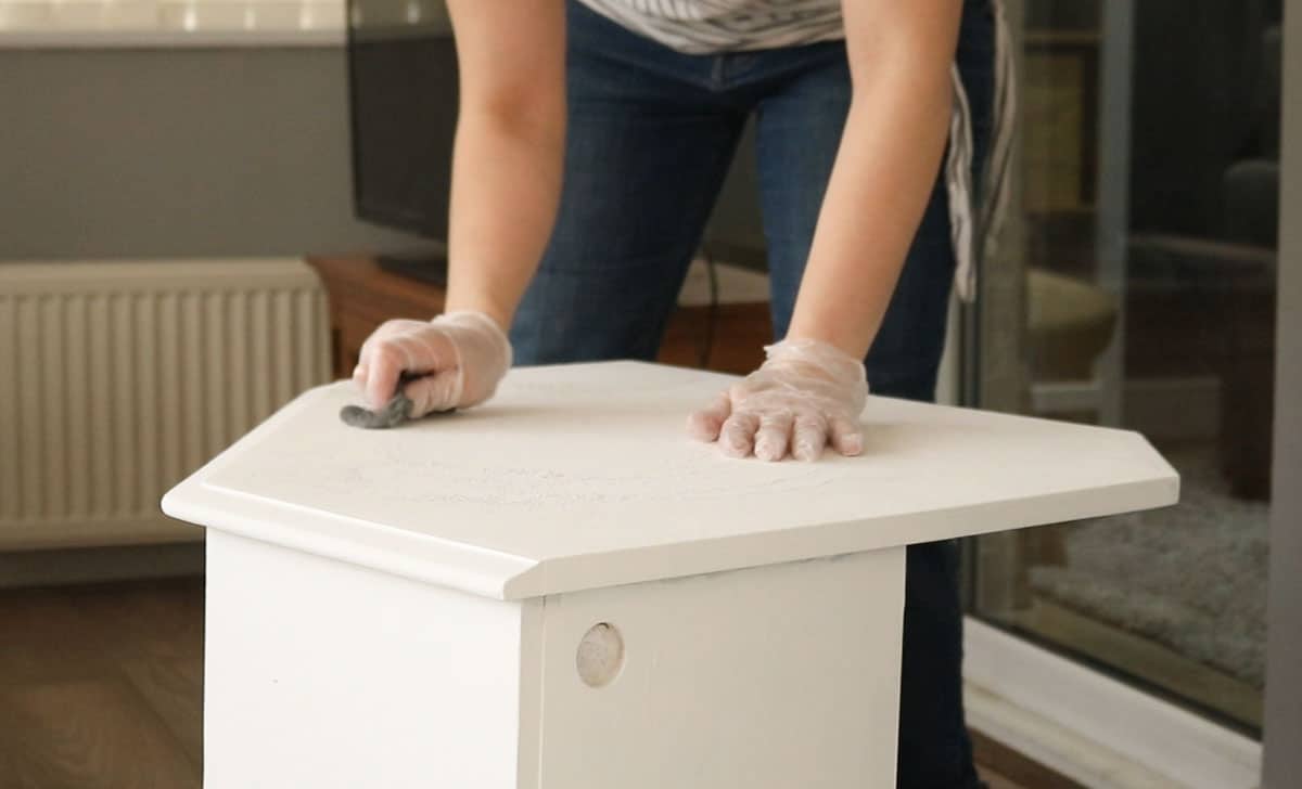 sanding back chalk paint with fine 0000 wire wool for a super fine finish