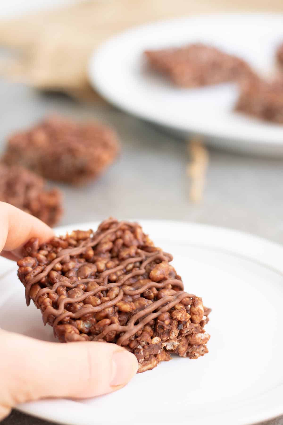 grabbing rice krispies treat with chocolate orange