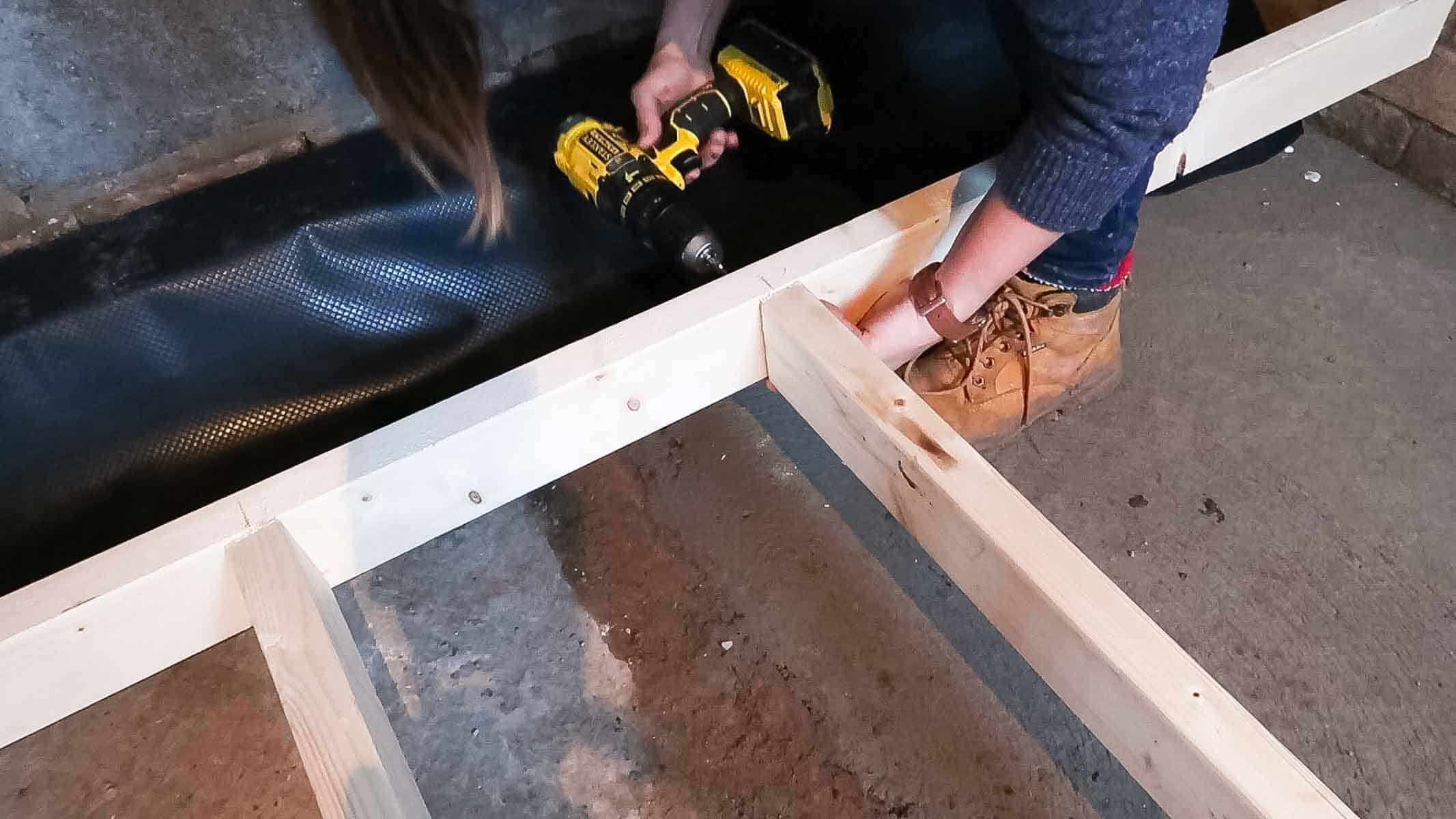 screwing the studded wall together