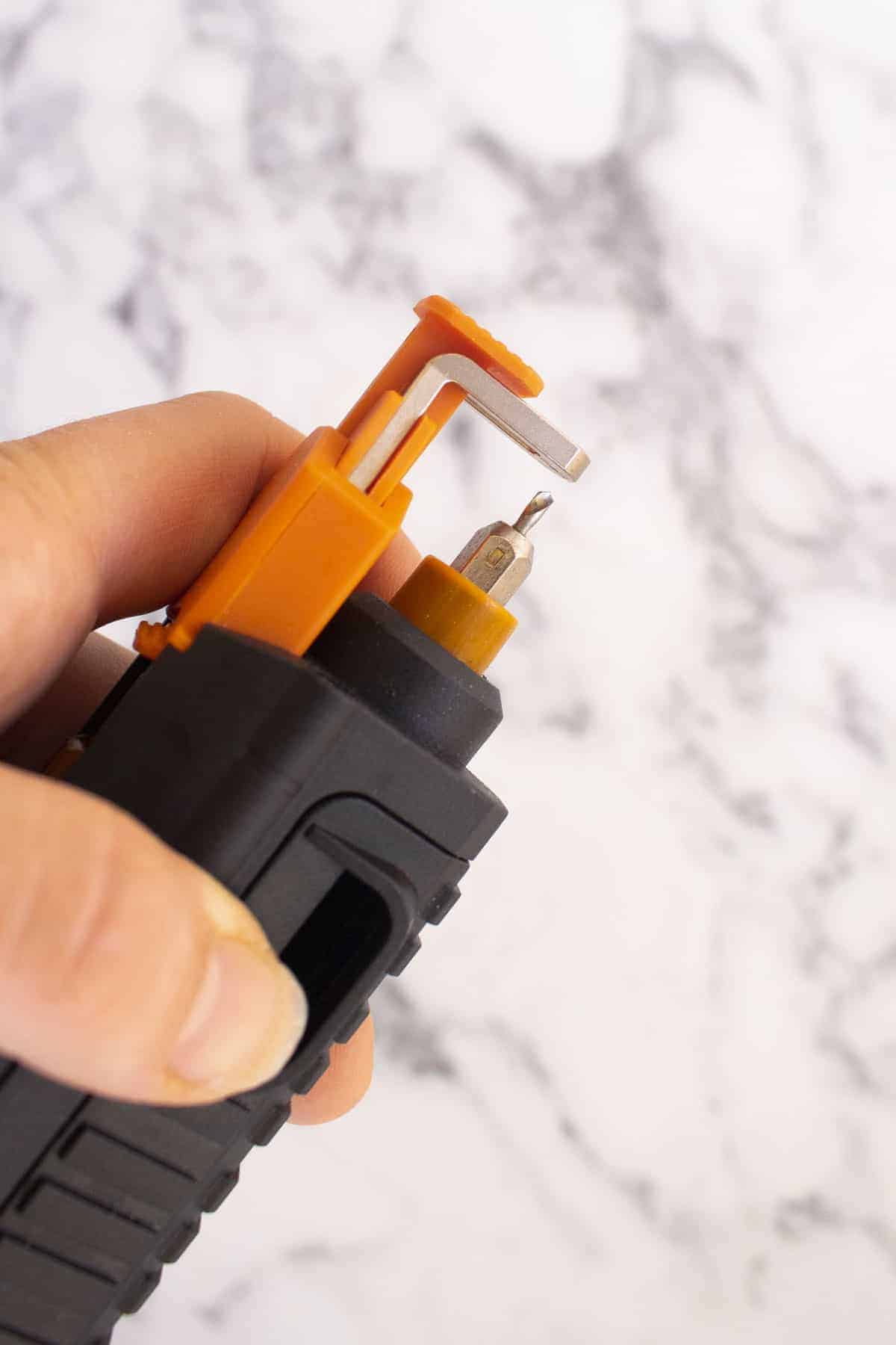 Testing a Worx drill bit to create pilot holes in the SD slide driver with extra screw holder function