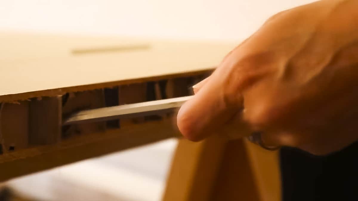 pushing back a hollow door's honeycomb centre with a chisel