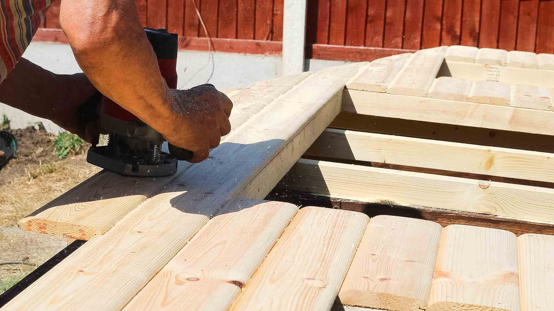 Removing excess cladding on a shed with a flush trim router bit