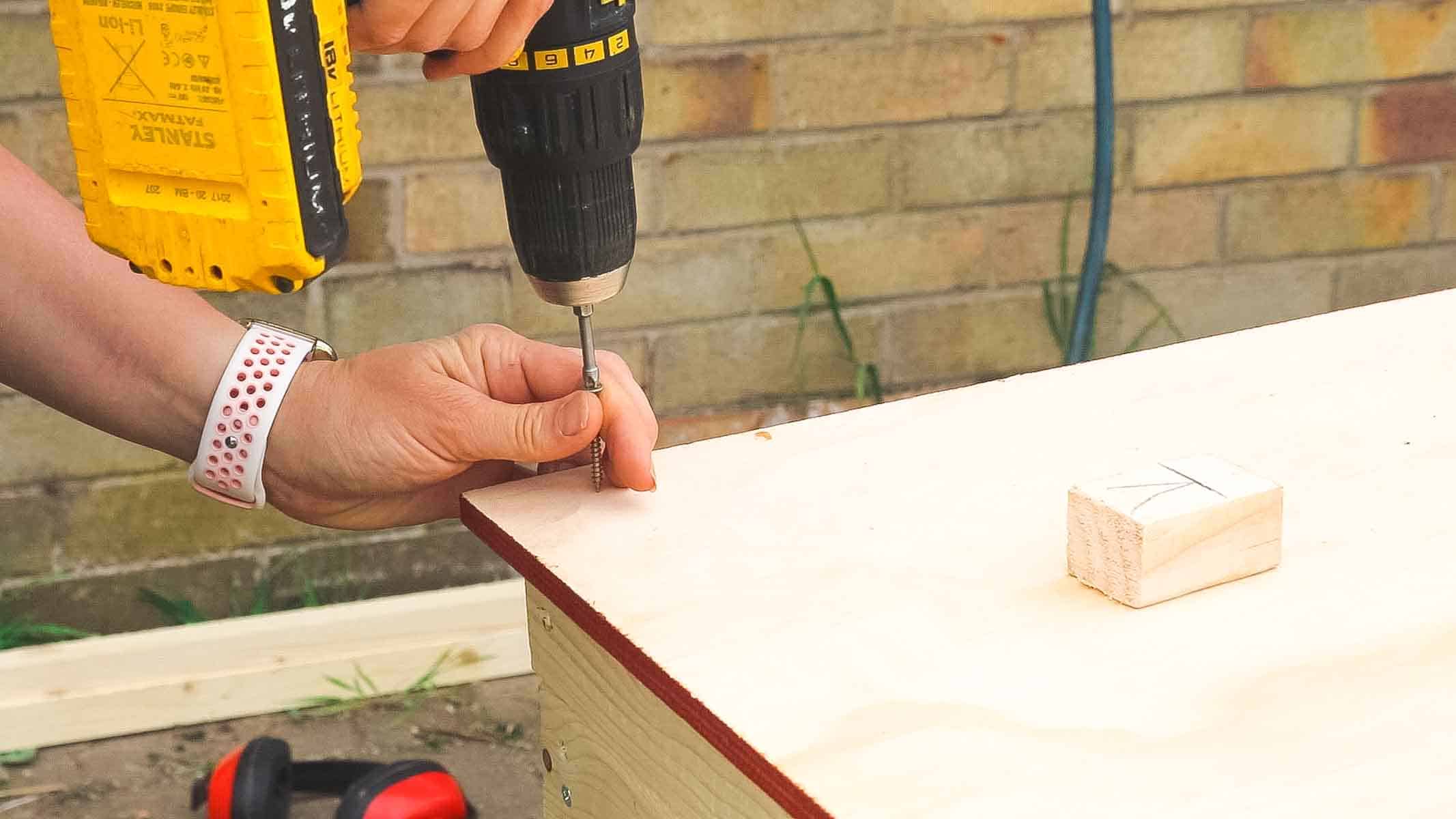 Applying plywood cladding to a shed