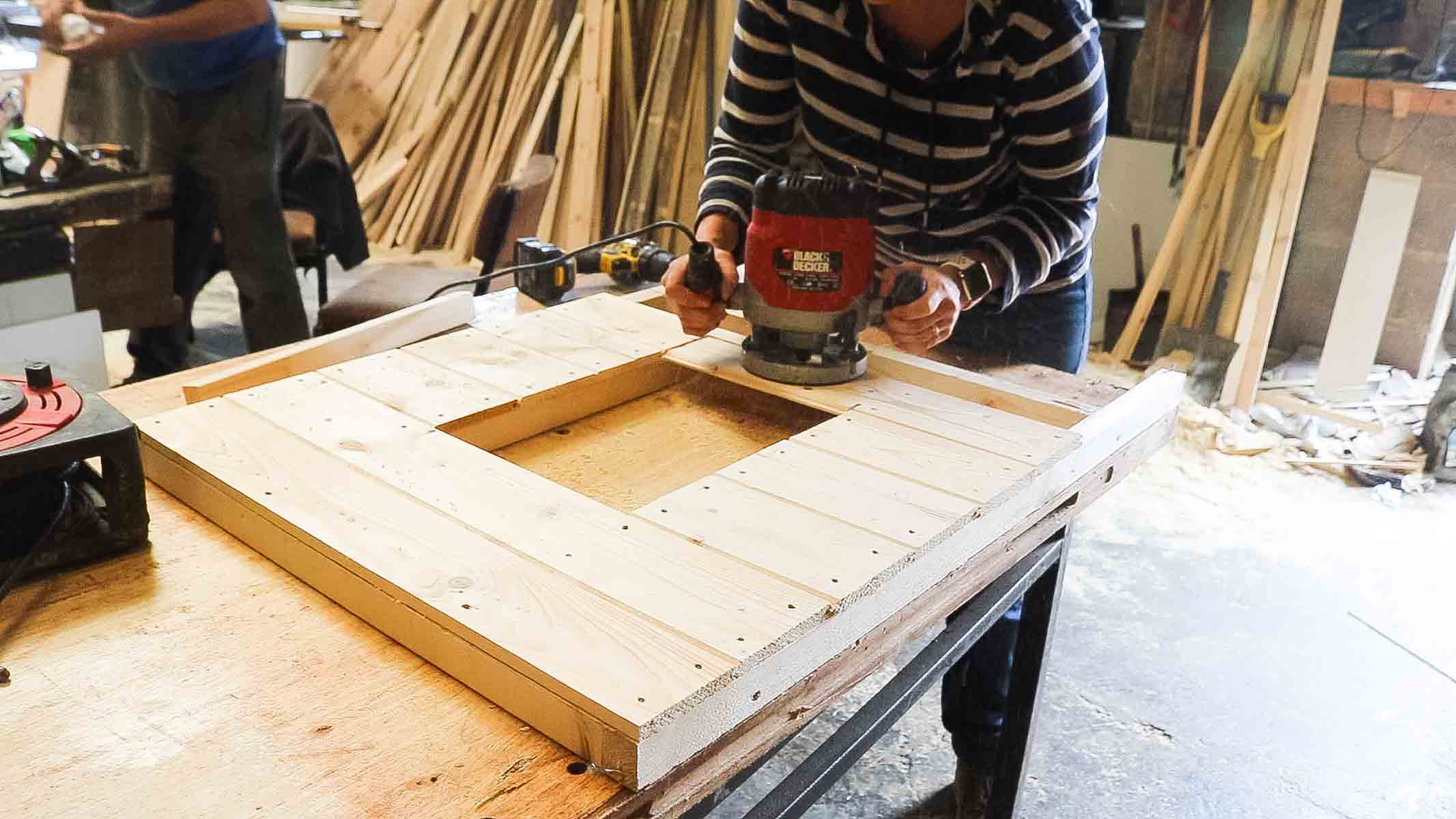 using a router on chicken coop's door to remove excess with a flush trim bit