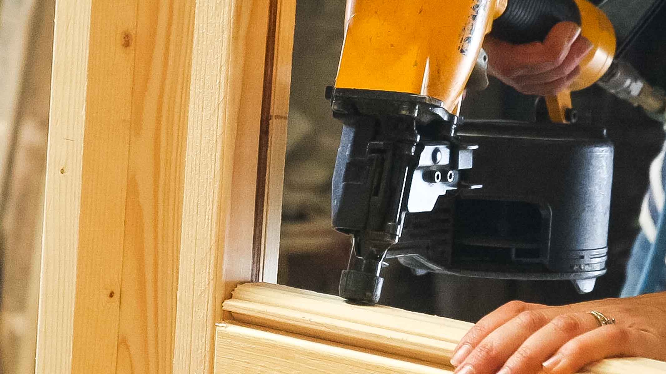 nail gunning a stop lat to chicken coop door
