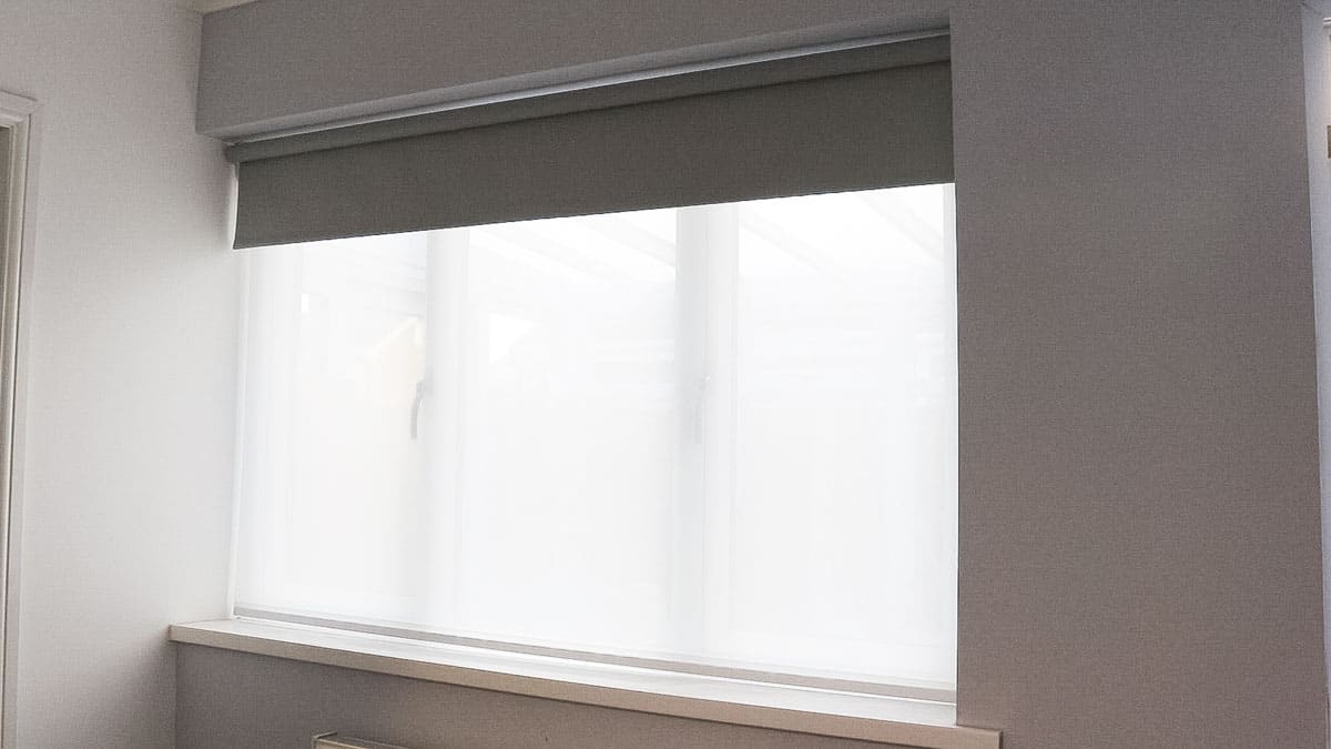 half open double roller blinds in daylight