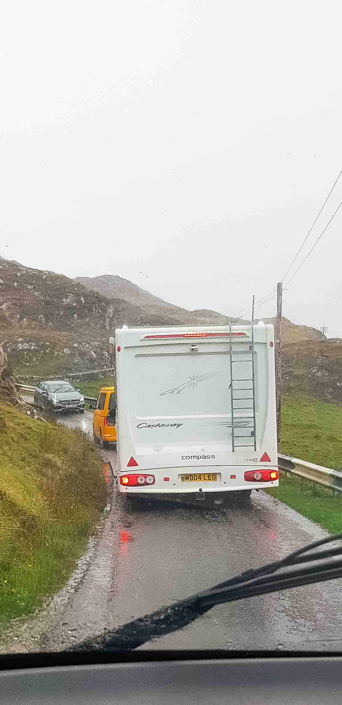 traffic on a single track road in poor weather conditions