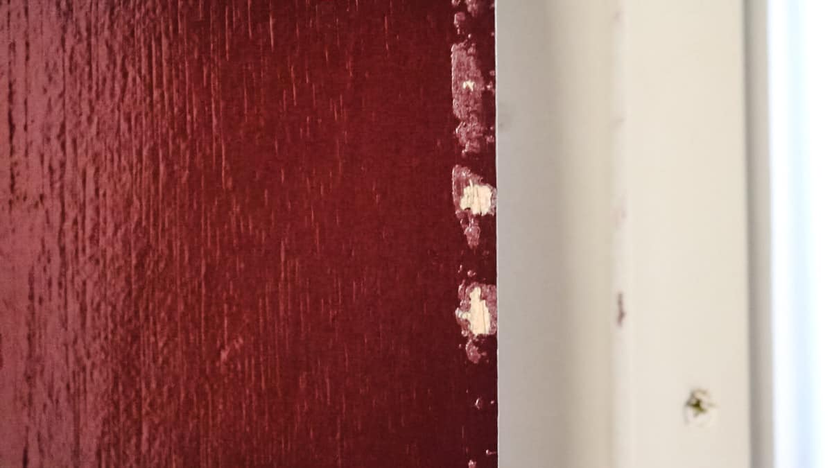 Chipped paint in satin wood from closing before the paint has fully cured