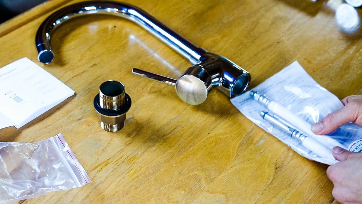 New mono mixer tap laid out on a table with Speedfit hoses