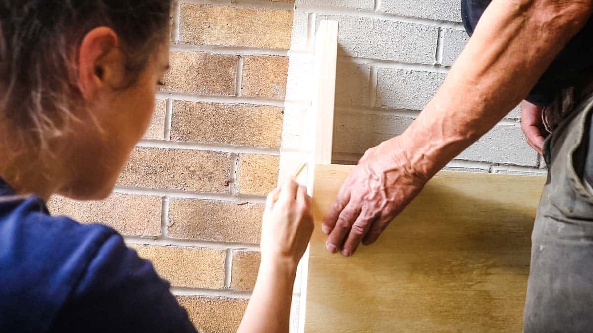Drawing along side stud for refence on brick wall
