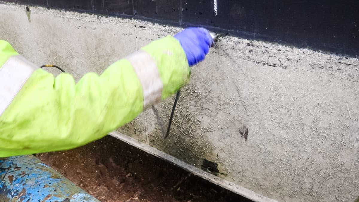 Steel hull being checked with a probe for thickness