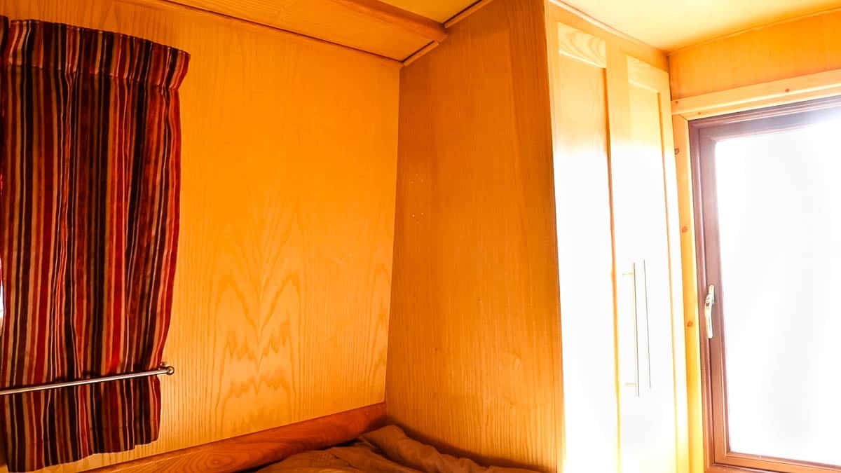 Ash ply lined wardrobe in a narrowboat bedroom