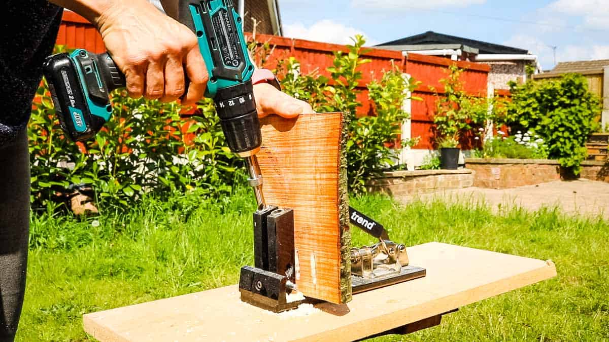 Drilling pocket holes in log DIY projects for birds in your garden