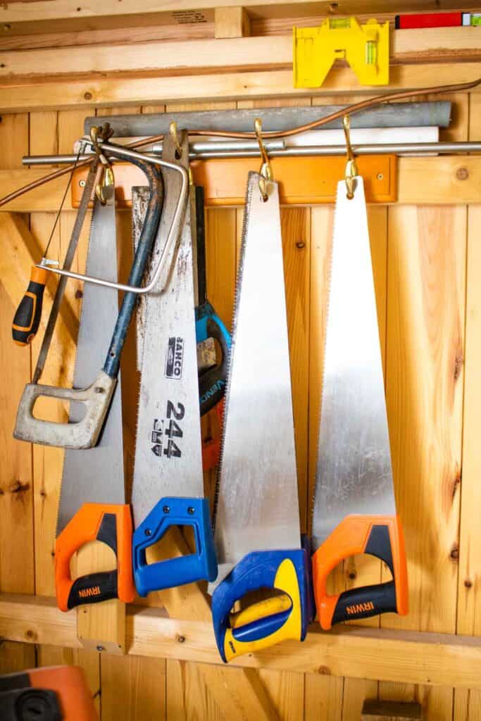 hammer storage ideas for a shed hanging on a coat rack