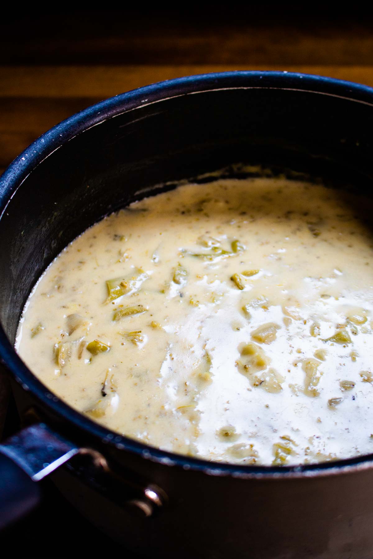 Saucepan full of cheesy broccoli soup cooked on a narrowboat