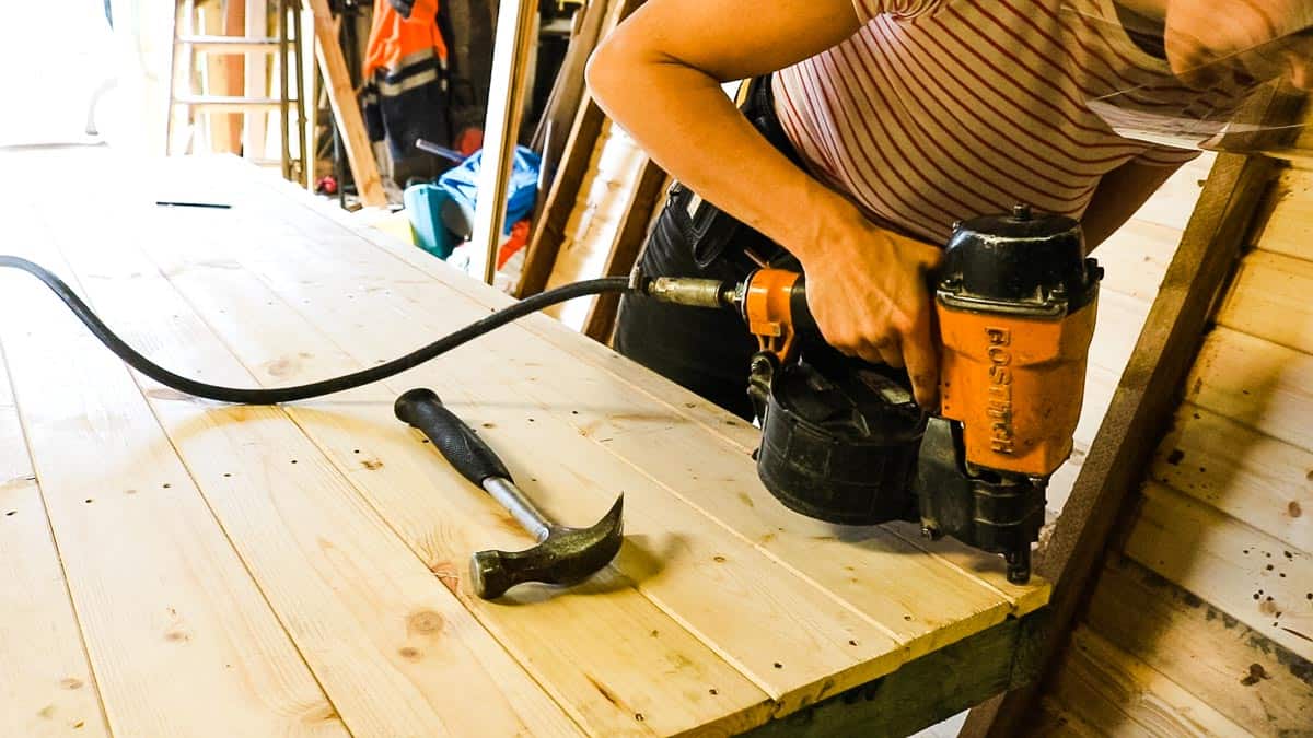 Nailing cladding on a shed base with Bostitch nail gun