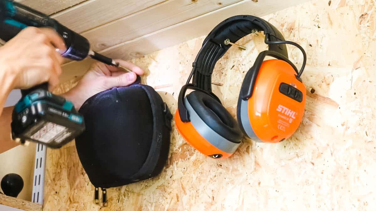 Hanging things with screws along with ear defenders to a DIY tool storage wall