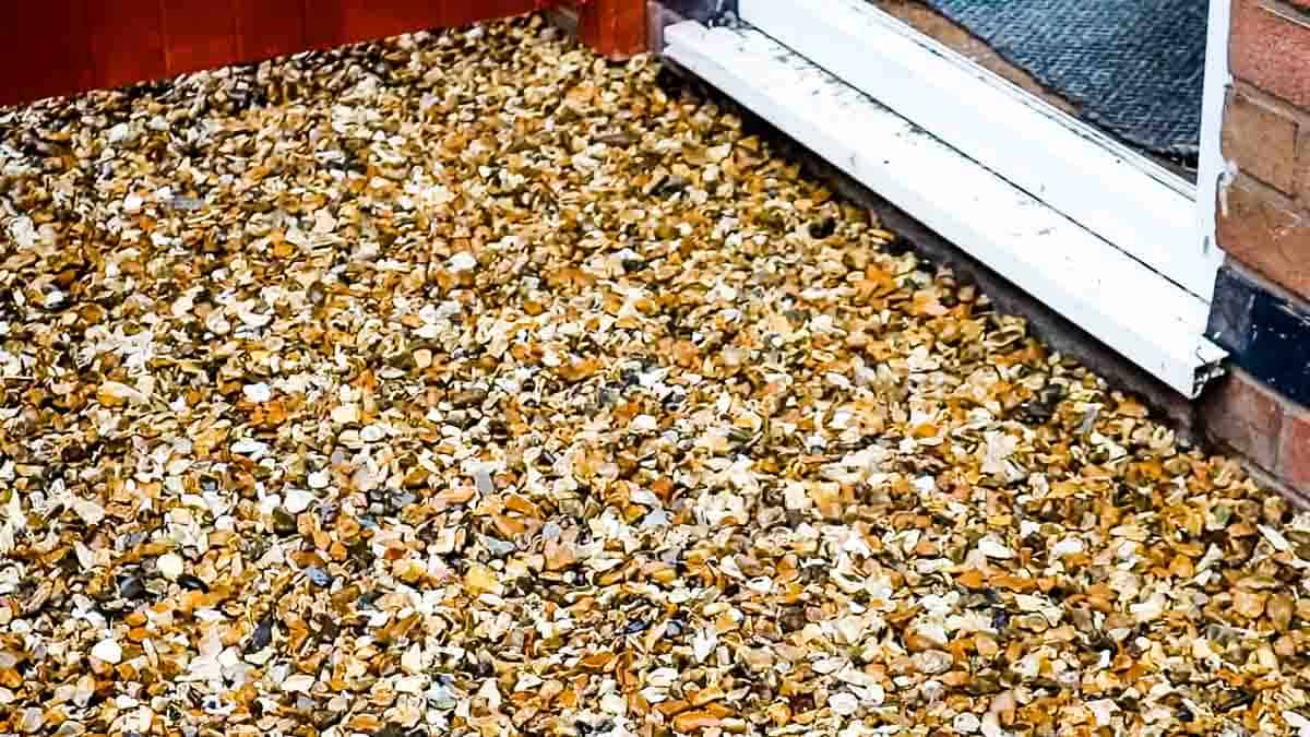 Close up of driveway rock in front of a house door