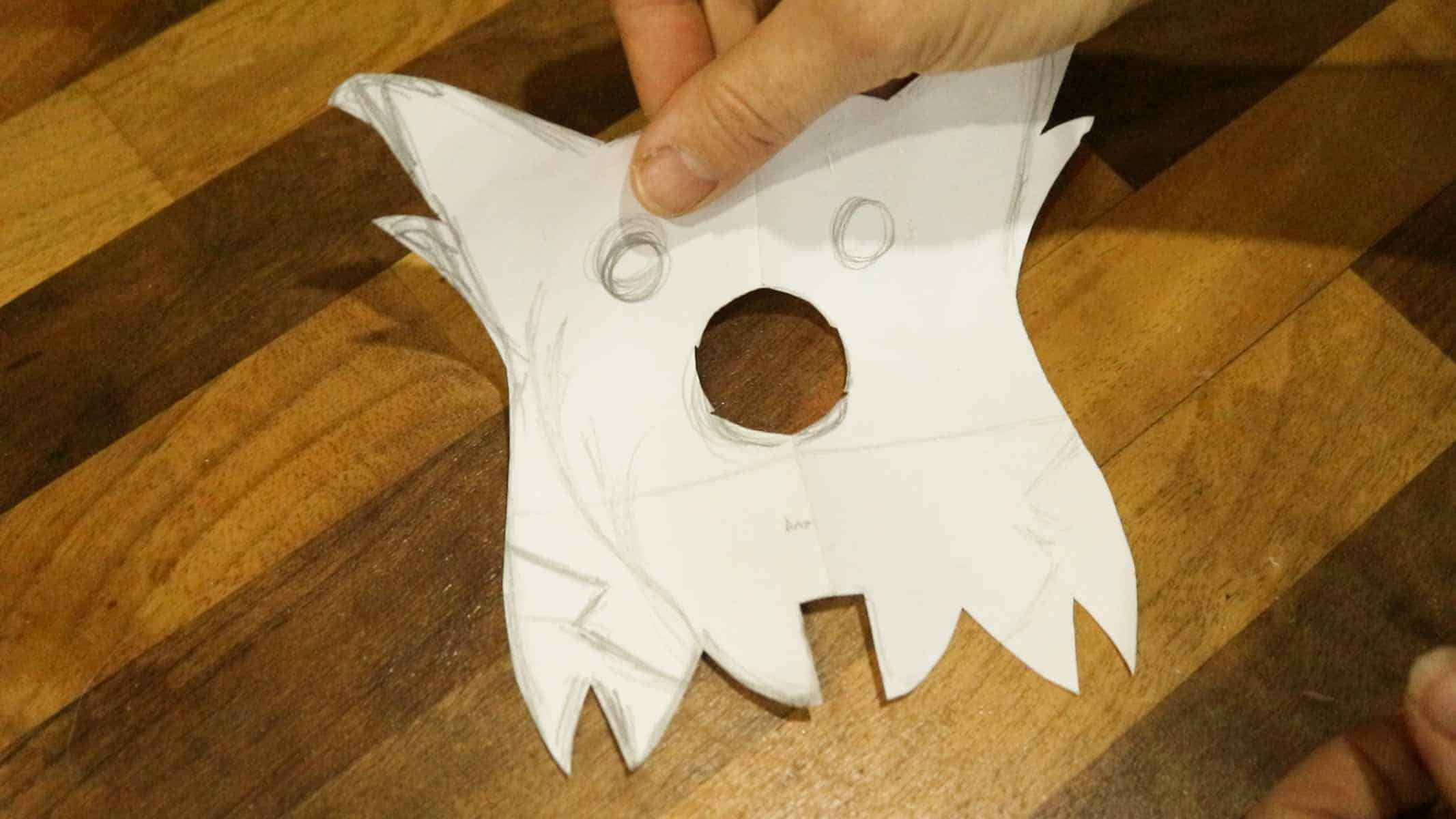 Hand drawn dog face in folded paper
