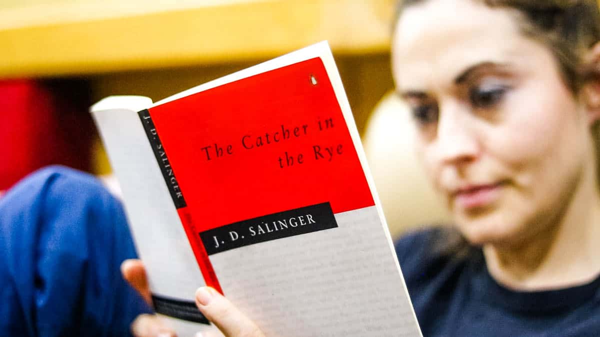 Woman reading Catcher in the Rye by J D Salinger