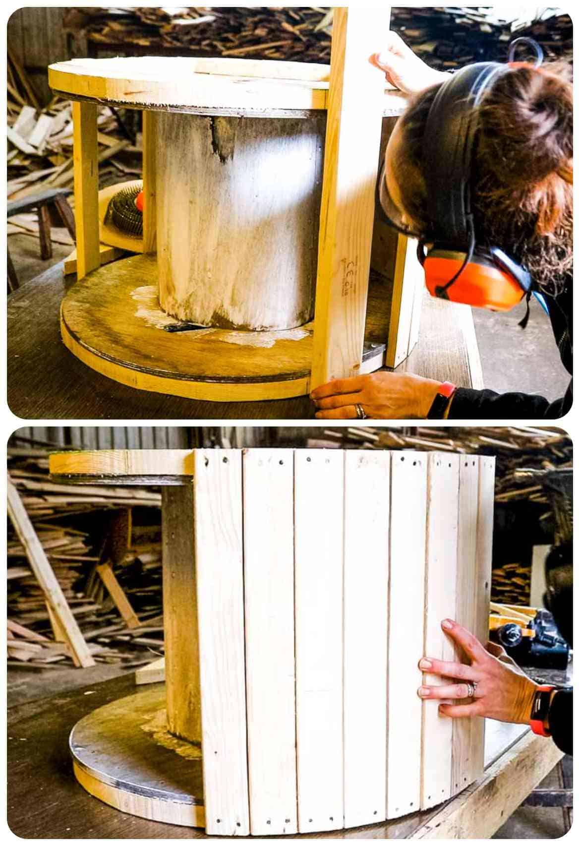 girl demonstrating how to make a wishing well by cladding the side of a cable drum