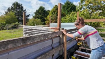 Fixing an upright timber assembly alongside the existing rear structure.